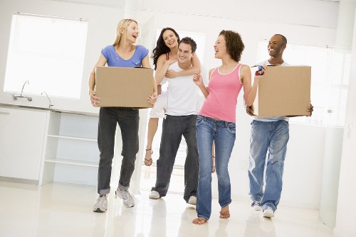 Removal team packing boxes for a home move in Hounslow