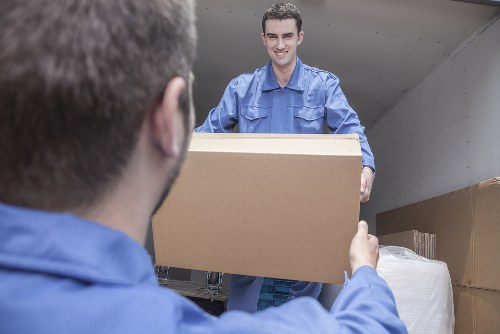 Man with van loading furniture in Hounslow