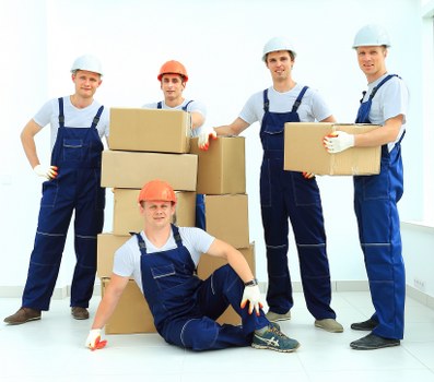 Furniture removal crew loading a sofa during a Hounslow pick-up