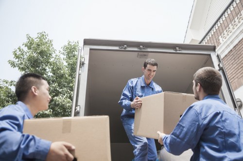 Packed moving boxes and furniture ready for house removals in Hounslow