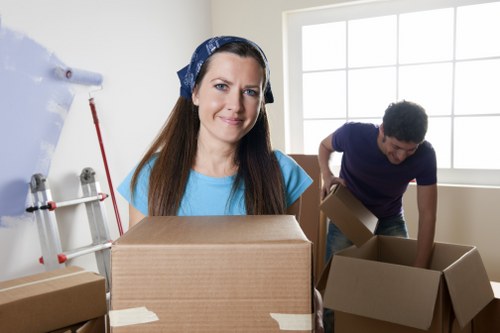 Commercial office move process with labelled boxes and furniture