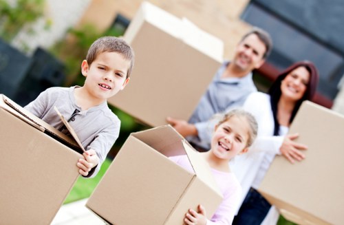 Professional removals crew loading items into a van