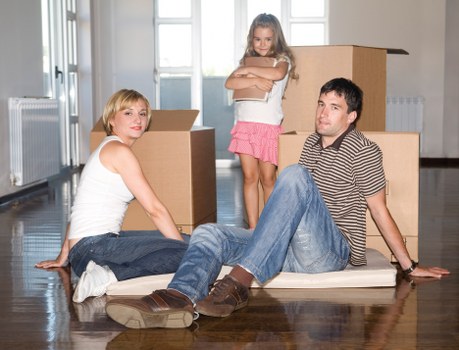 Local removals team handling furniture carefully in a Hounslow property